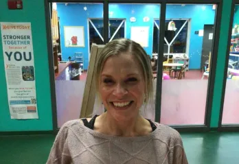 Betty J. Pullum Family YMCA member Stephanie smiles for a photo at the welcome center.