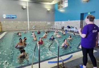 Members in the activity pool at BLS are pictured working through a water aerobics class led by Lorrie.