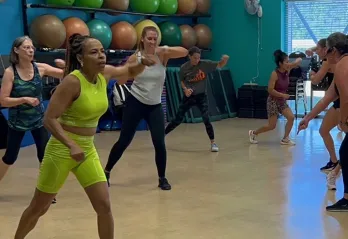 Participants in a Body Combat class at the Betty J Pullum YMCA are pictured mid-rep during a class.