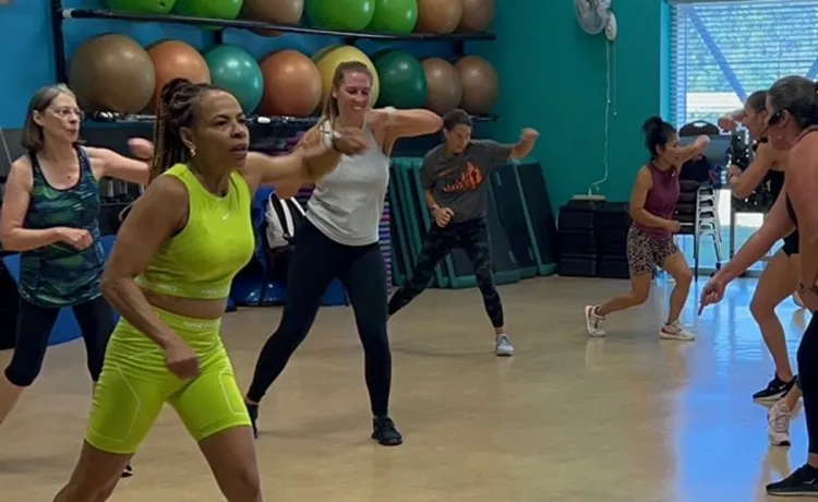 Participants in a Body Combat class at the Betty J Pullum YMCA are pictured mid-rep during a class.