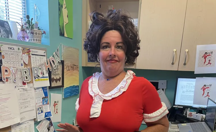 Executive Branch Director Autumn strikes a comedic pose while wearing a costume, celebrating her recent birthday in style.