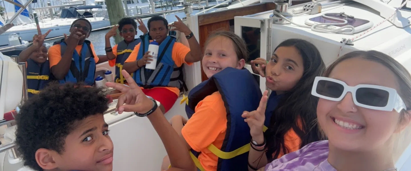 group of teens on sailing trip