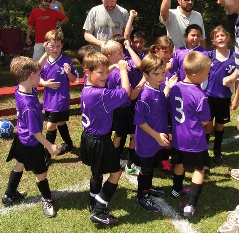 kids celebrating soccer game win