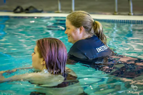 instructor in pool with student