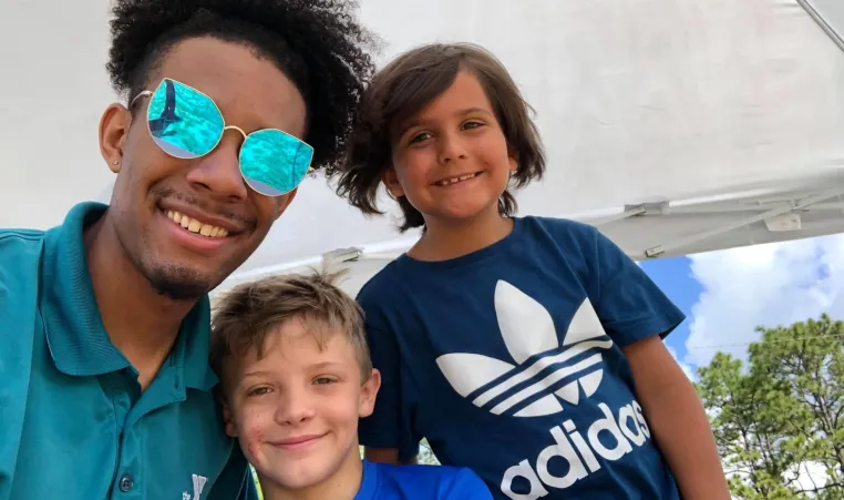 camp kids and their counselor