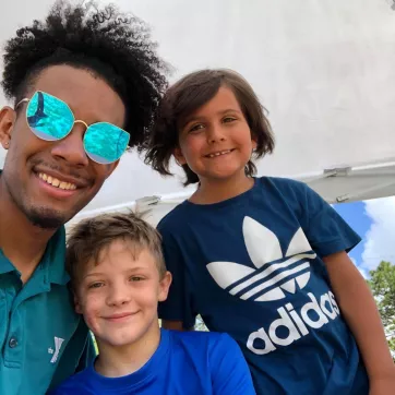 camp kids and their counselor