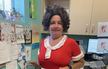 Executive Branch Director Autumn strikes a comedic pose while wearing a costume, celebrating her recent birthday in style.